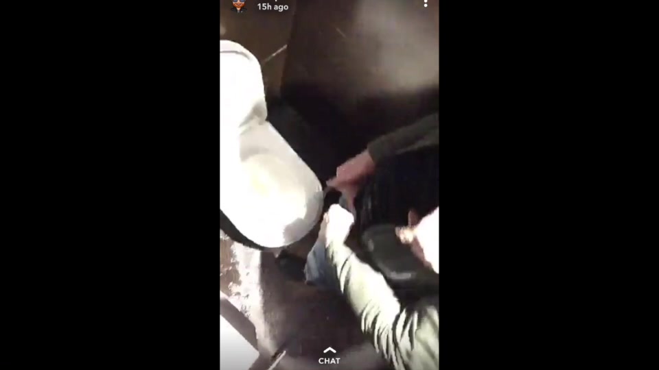 Lad messing with his mate while he has a piss