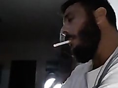 Sexy bearded man smoking