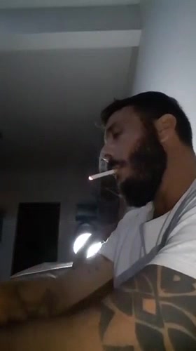 Sexy bearded man smoking