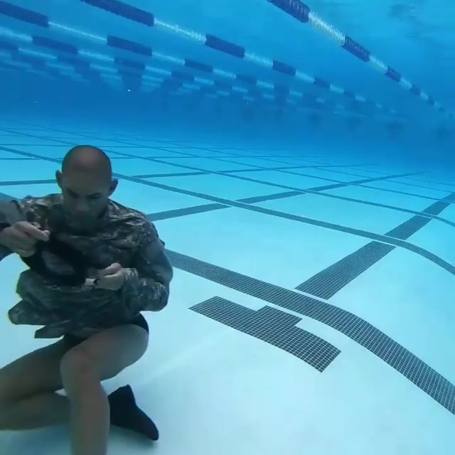 Swimming barefaced underwater in pool - video 2