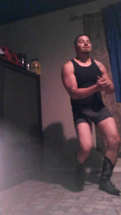 Hot latin cowboy dancing in boots and boxer