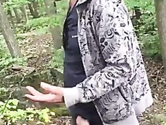 Old man pissing in the woods