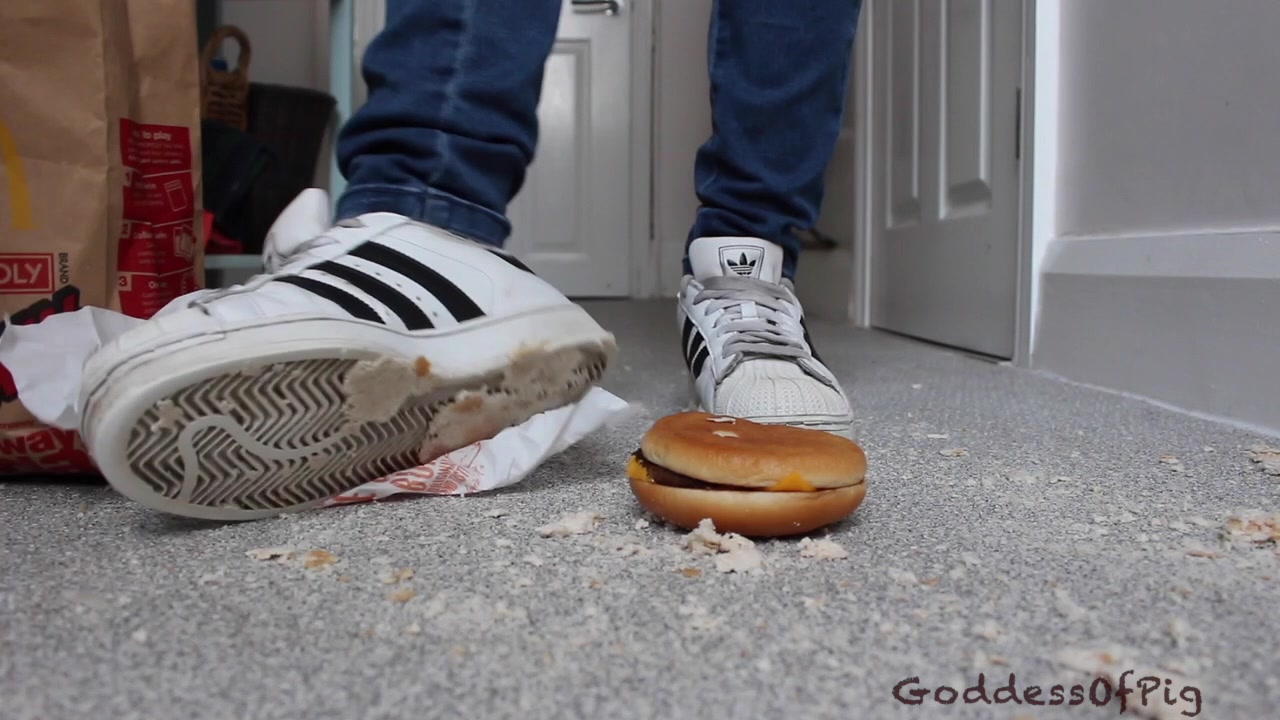 Goddess Tramples Burger In White & Black Adidas Superstar Sneakers