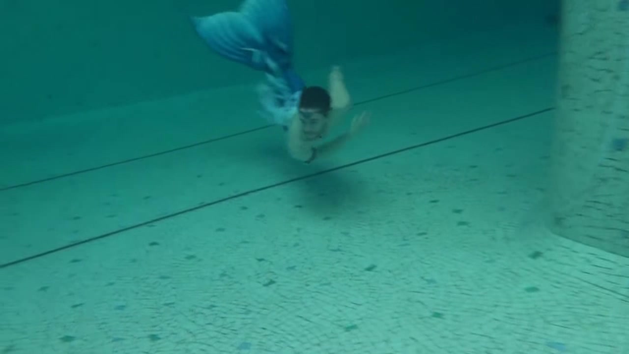 Mermen swimming barefaced underwater