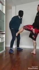 Master kicking his slave's balls