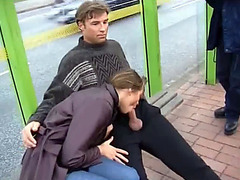 Shameless blowjob on a bench of bus stop