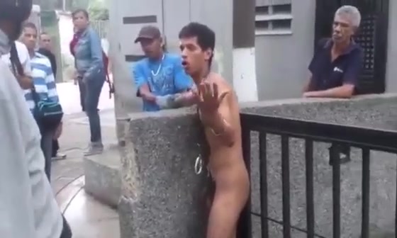 stripped latino thief in public