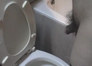 Ladyboy Jane pissing in toilet