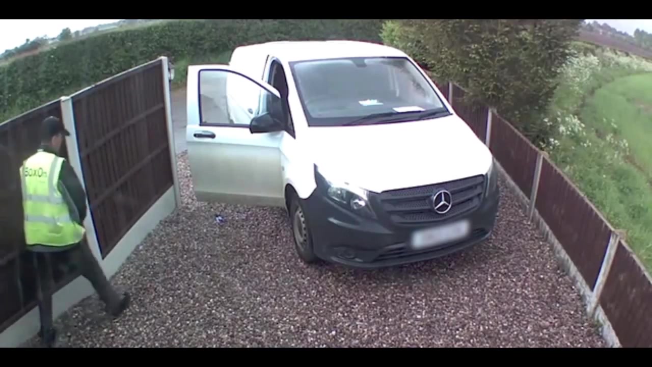Delivery driver urinates on fence