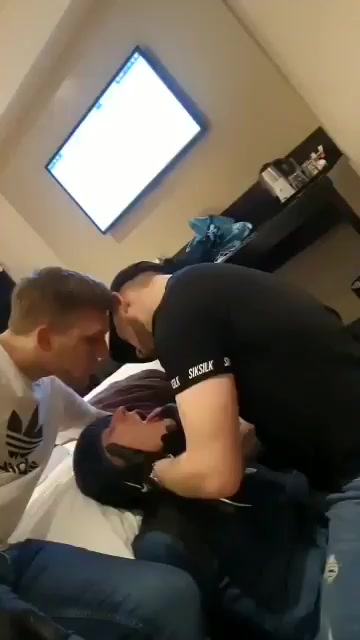 Two guys spit in their mouths and gagging