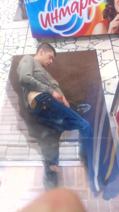 Drunk guy pissing inside grocery store