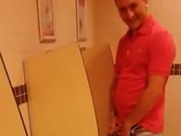 Guy filmed pissing at urinal