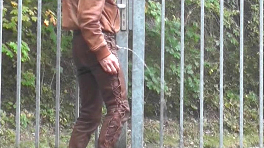 public pissing in brown leather