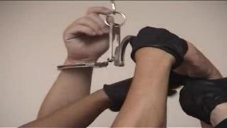 Cuffing the prisoner hands above head