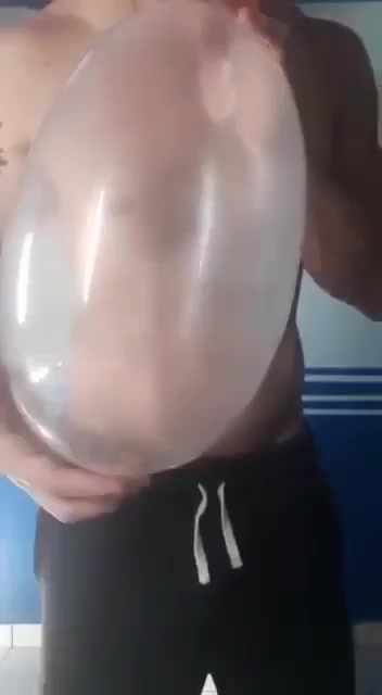 Hot Brazilian guy fucks a condom balloon
