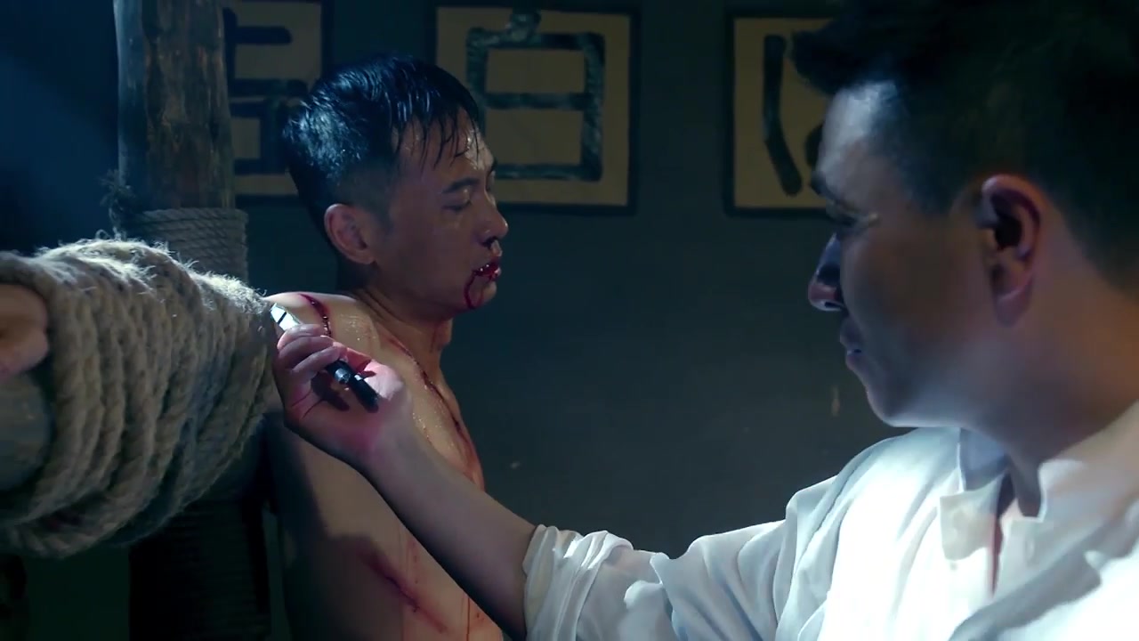Shirtless Asian man tortured with pliers