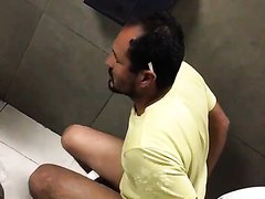 Mexican construction worker fucks a cucumber in the stall on his lunch brea