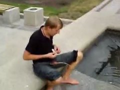 Guy pissing public while sitting