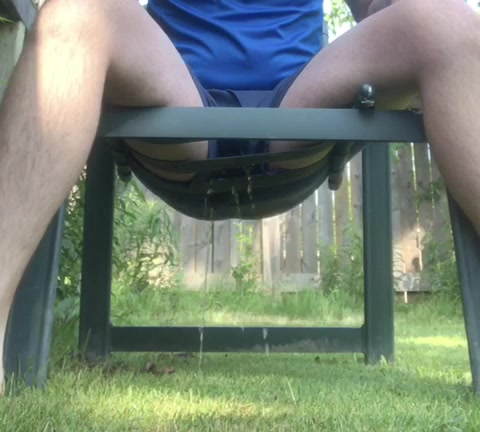 Pissing Outside in a Chair