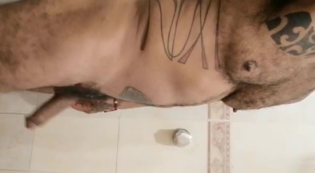 Tattooed guy showing cock