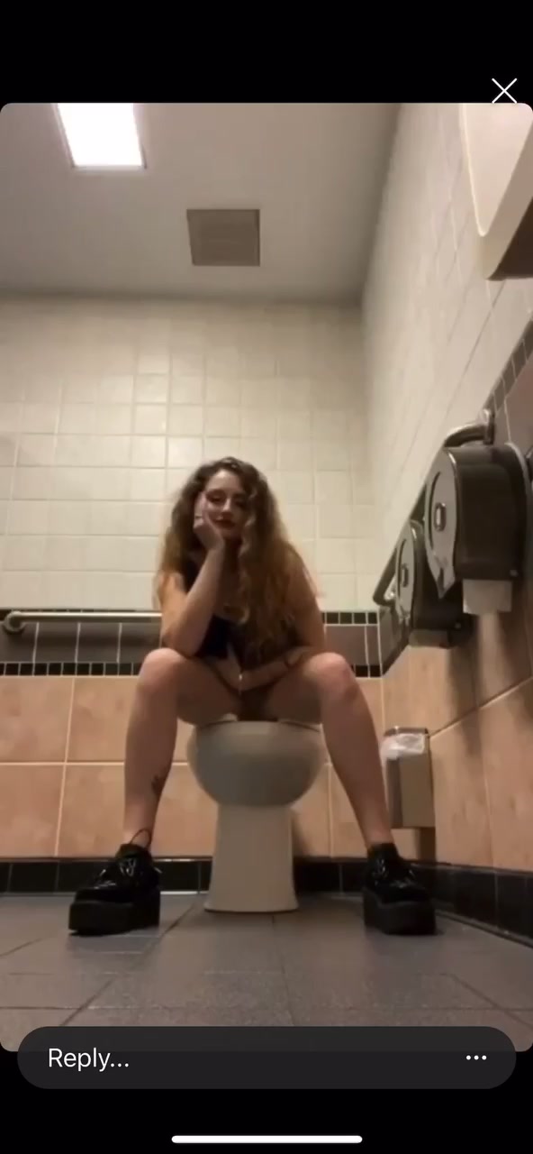 White girl  peeing in public bathroom