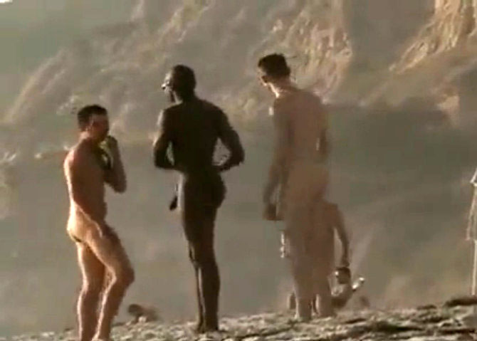 Three gays are walking at the beach