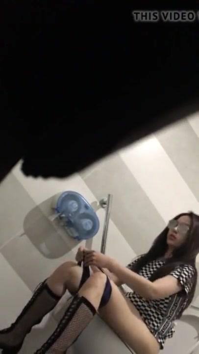 Asian girl caught peeing in the public toilets.