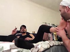 Sexy  Master get his feet licked while he smoke
