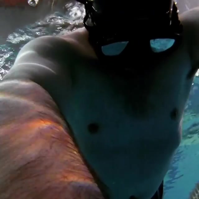 Hairy bearded freediver breatholds underwater