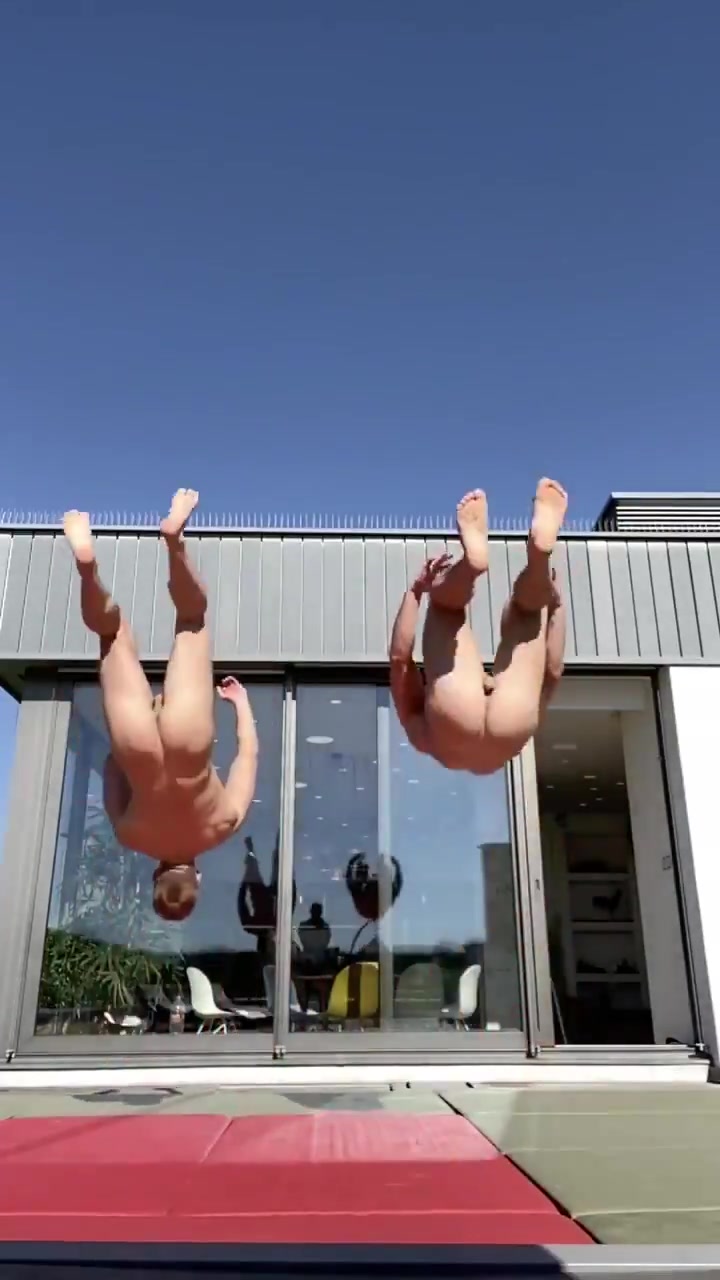 2 naked sexy hunks doing a flip