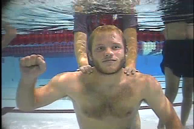 Barefaced redhead cutie exhaling air underwater