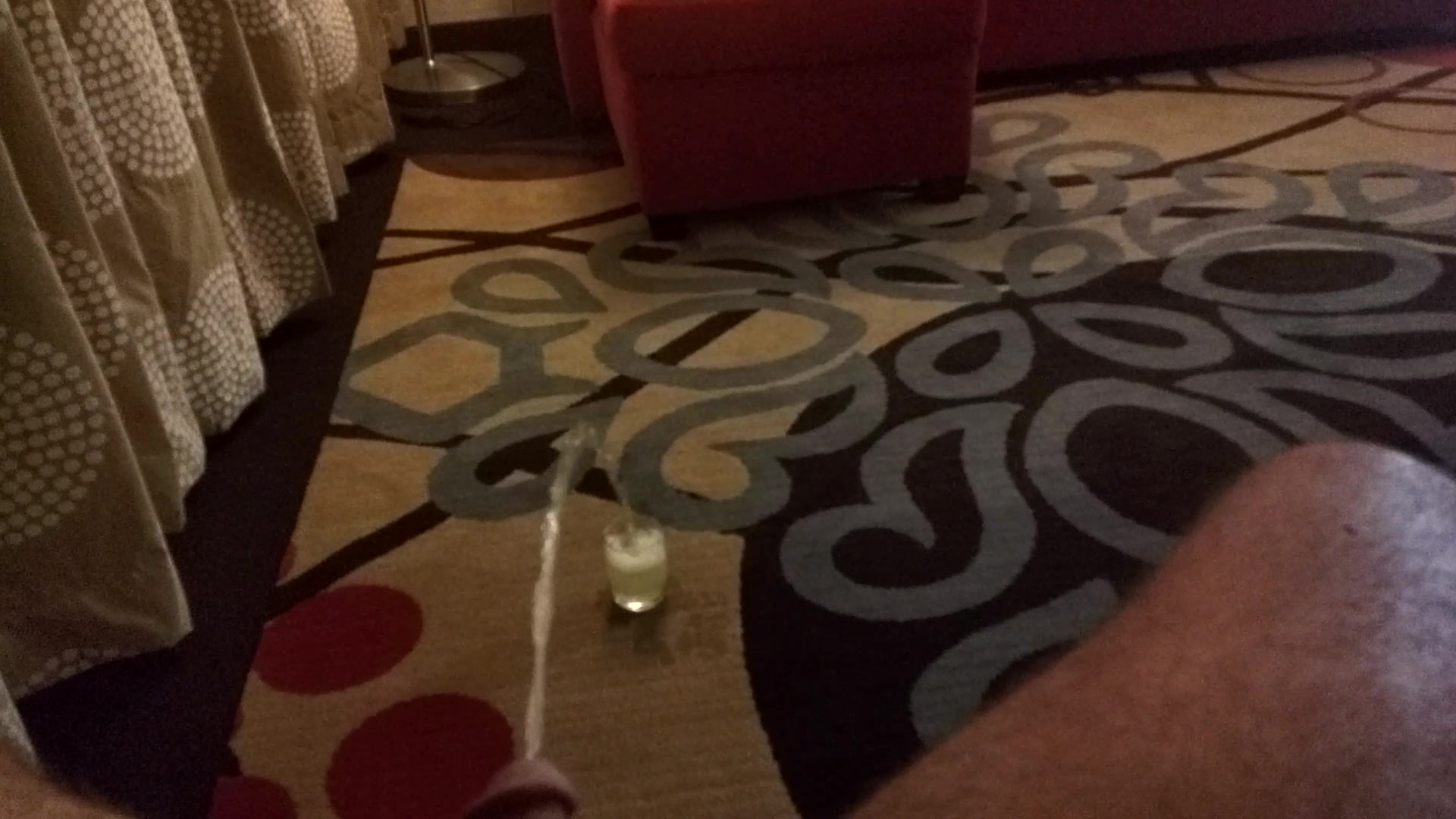 Piss on carpet into glass
