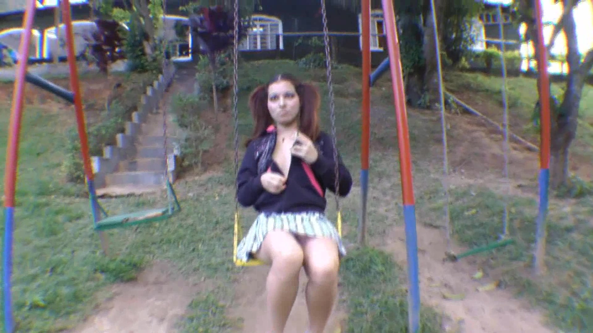 Cutie in Pigtails poops on a swing