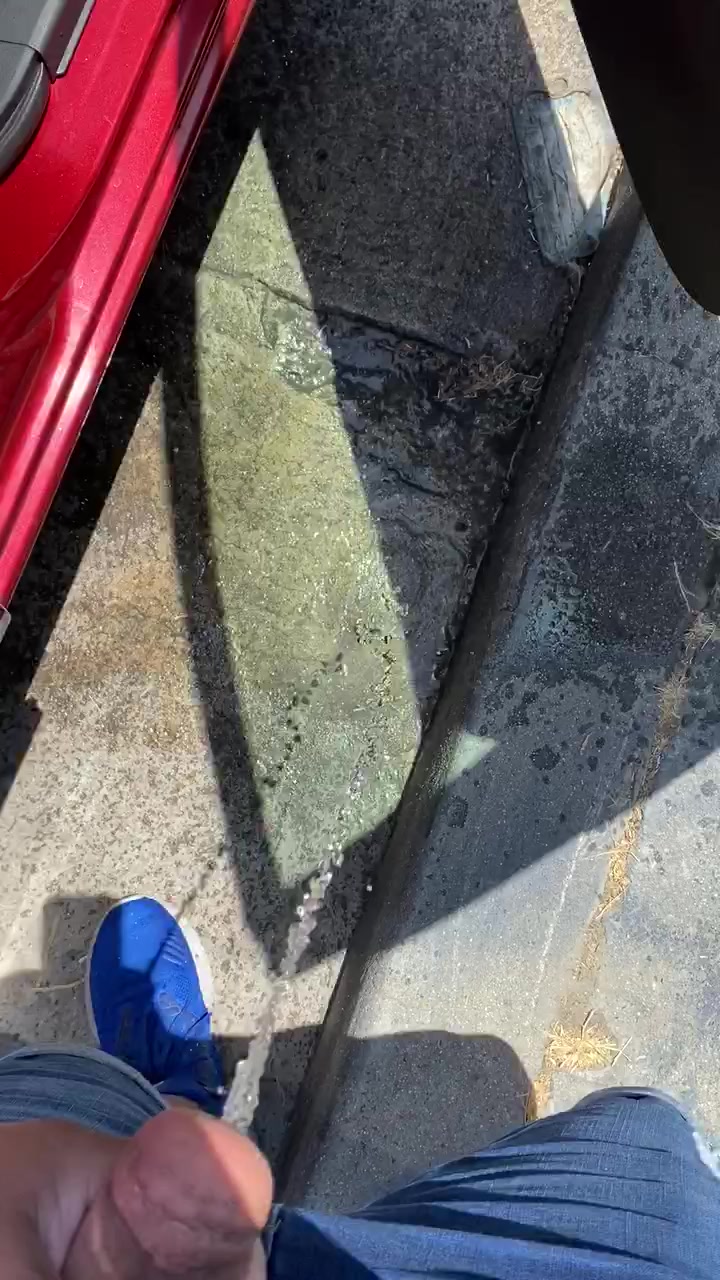 Desperate sidewalk piss in public
