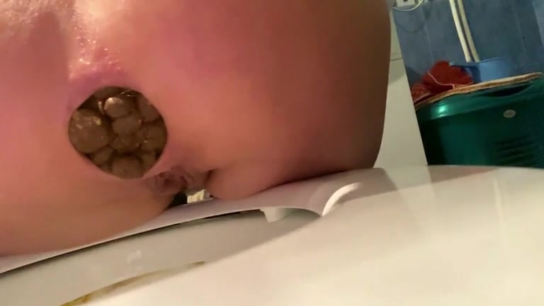 Blonde drops very fat turd in the toilet
