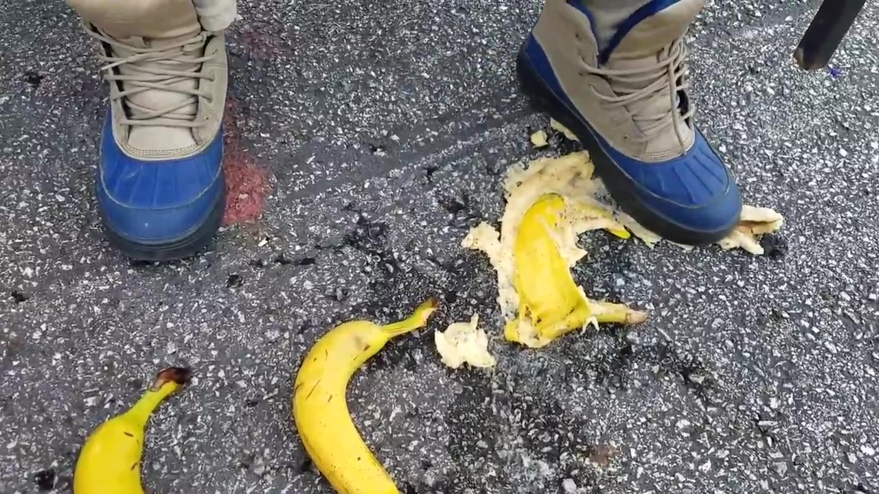 A man in boots smashing bananas