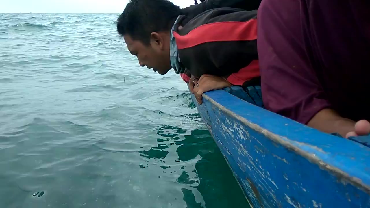 Indonesian Man Vomit at The Sea