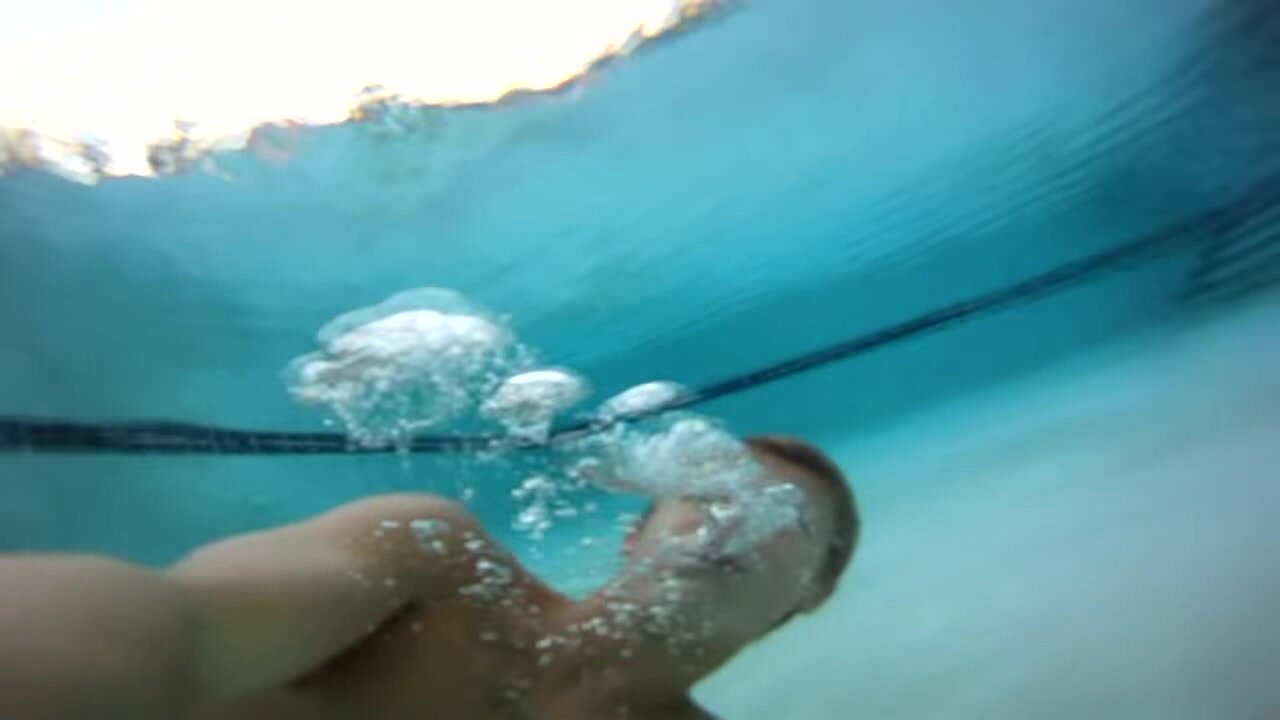Blondie swimming barefaced underwater