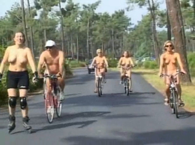 Naked girls with sexy tits biking outdoors