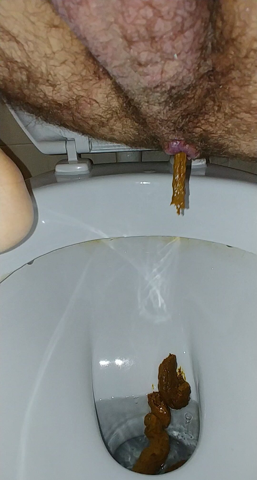 Shitting on the toilet - video 9