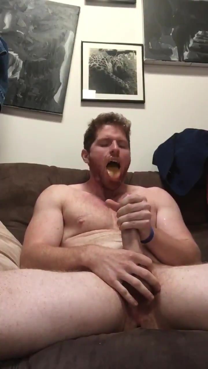Ginger splatters cum on his face and licks it off