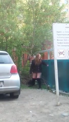Drunk Russian woman gets caught peeing near a building site