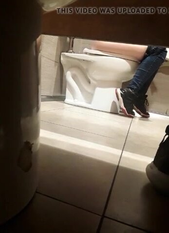 Milf on public toilet - video 2