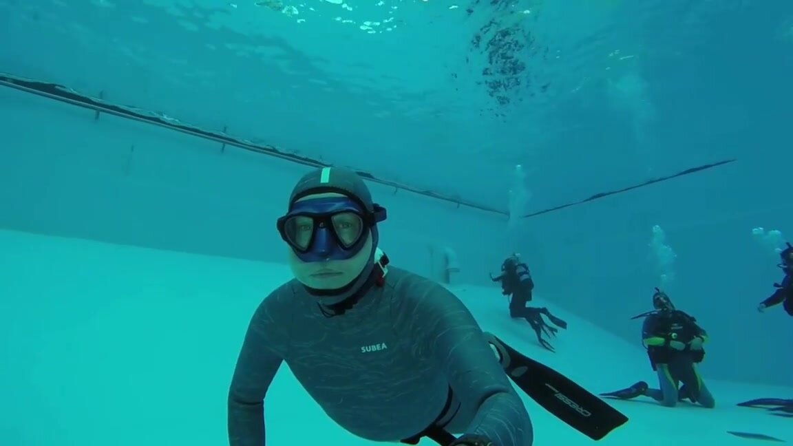 Breatholding underwater in tight wetsuit - video 3