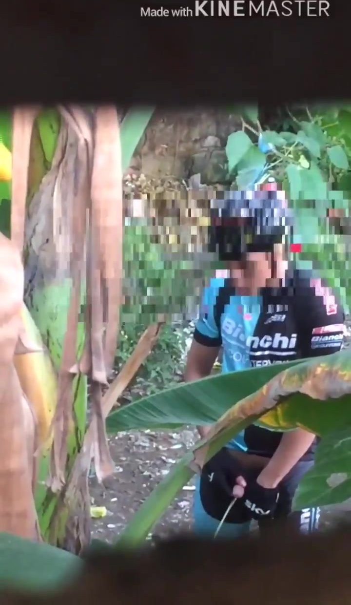 Filipino Cyclist caught peeing in the woods