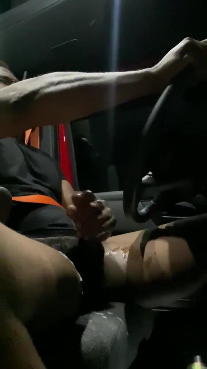 Homie jerks greasy cock while driving