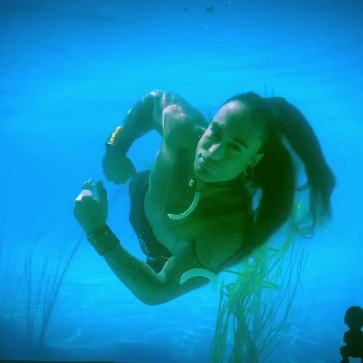 Underwater long haired barefaced merman
