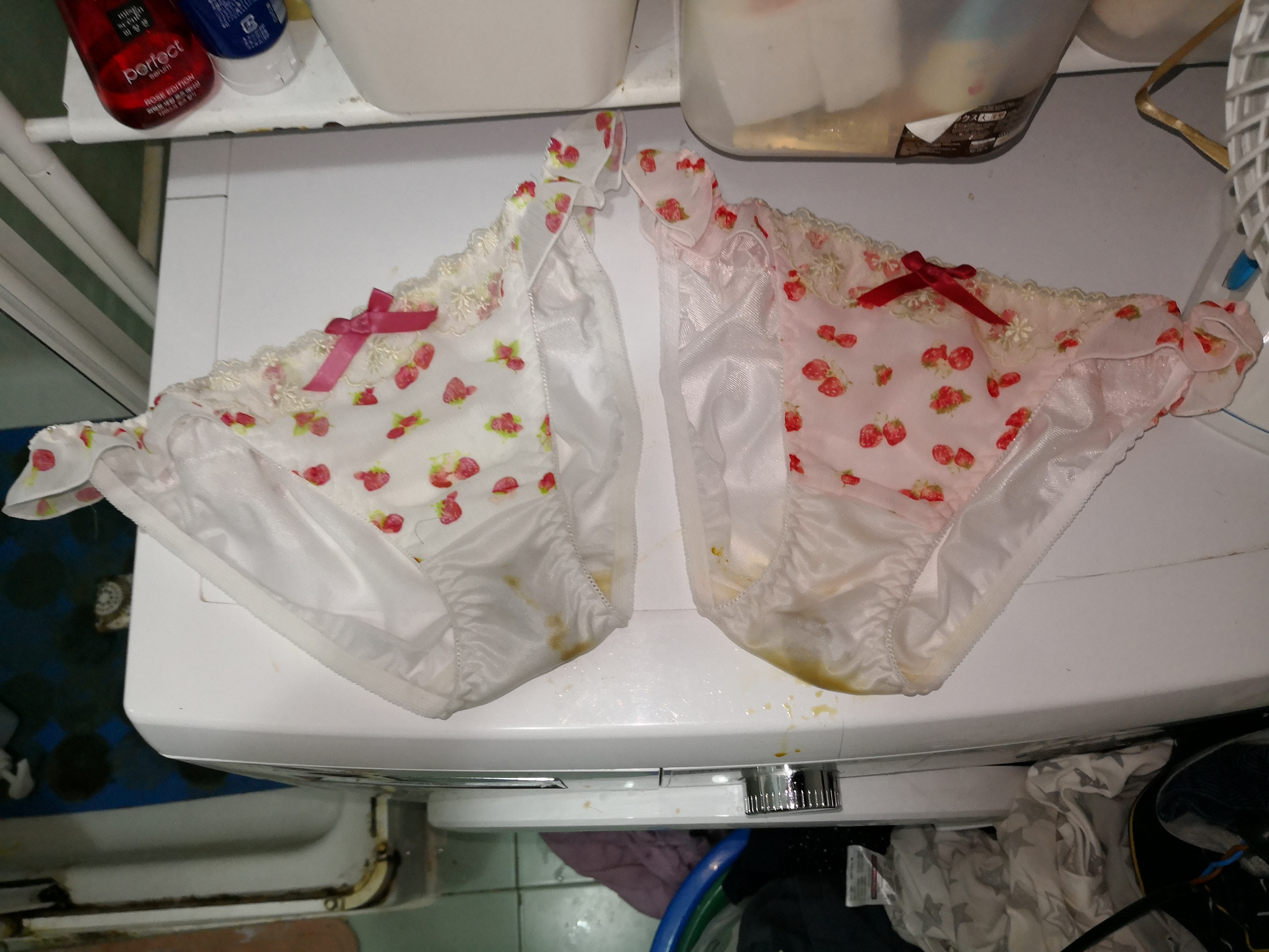 Two lovely Strawberry panties with a big shit insdie and it was extruding