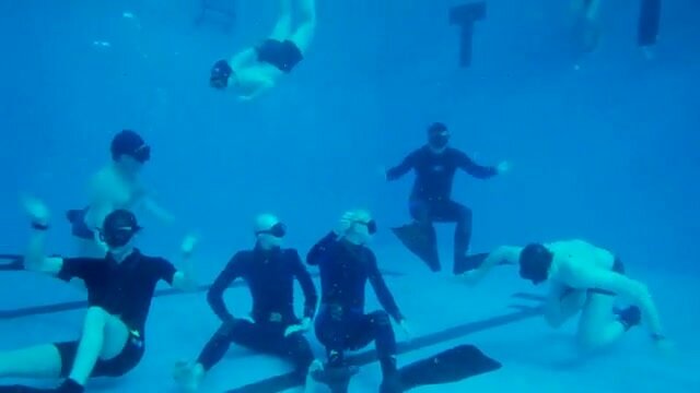 Cute freedivers breatholding underwater