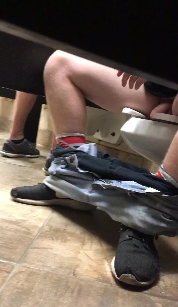 Cumming on guys shoe under stall publix